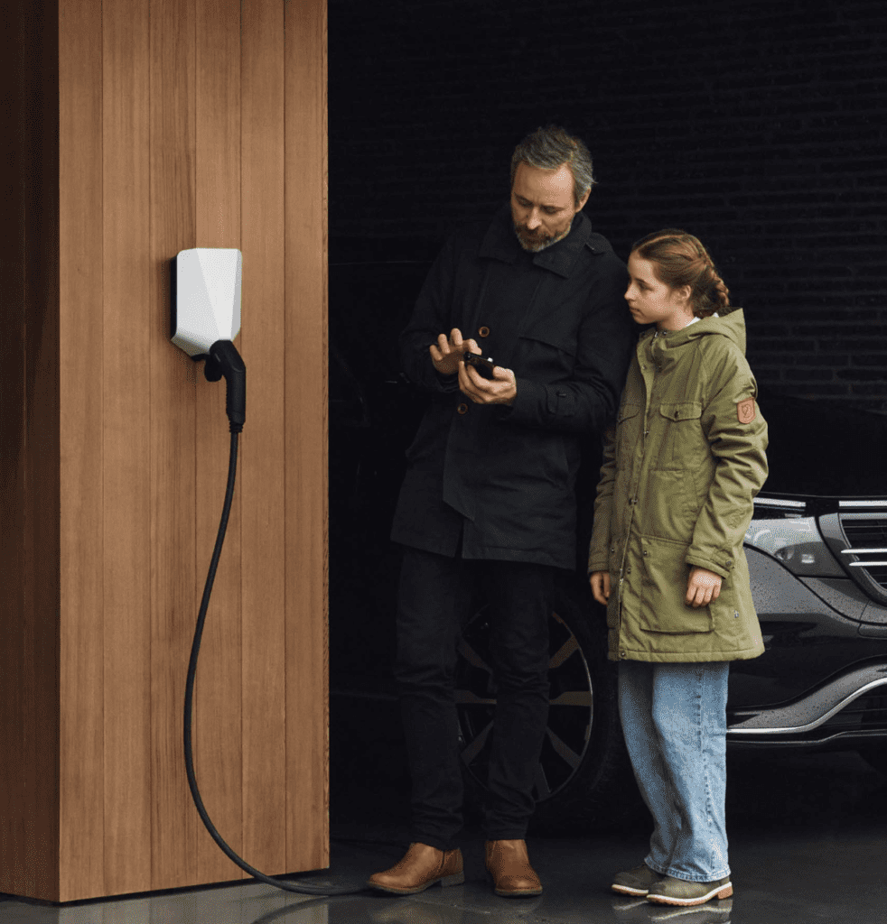 EASEE’s charging robot mounted to an exterior wall exposed to the elements